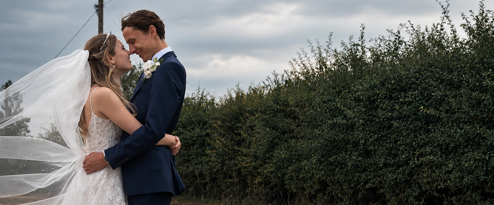 Bride and groom standing together outdoors